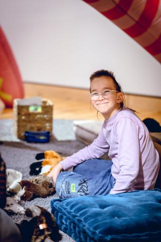 child playing in art gallery