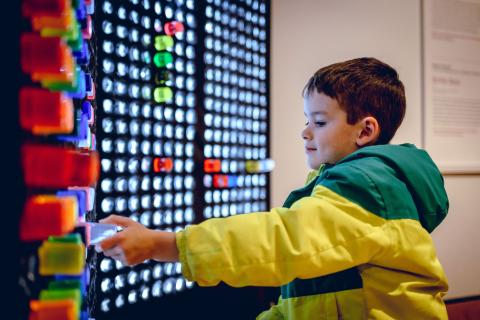 child playing in art gallery